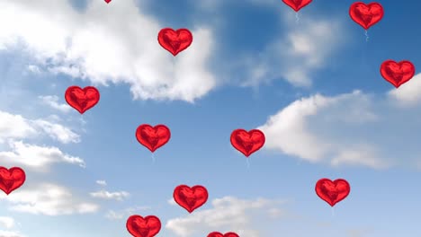 multiple heart shaped balloons floating against blue sky