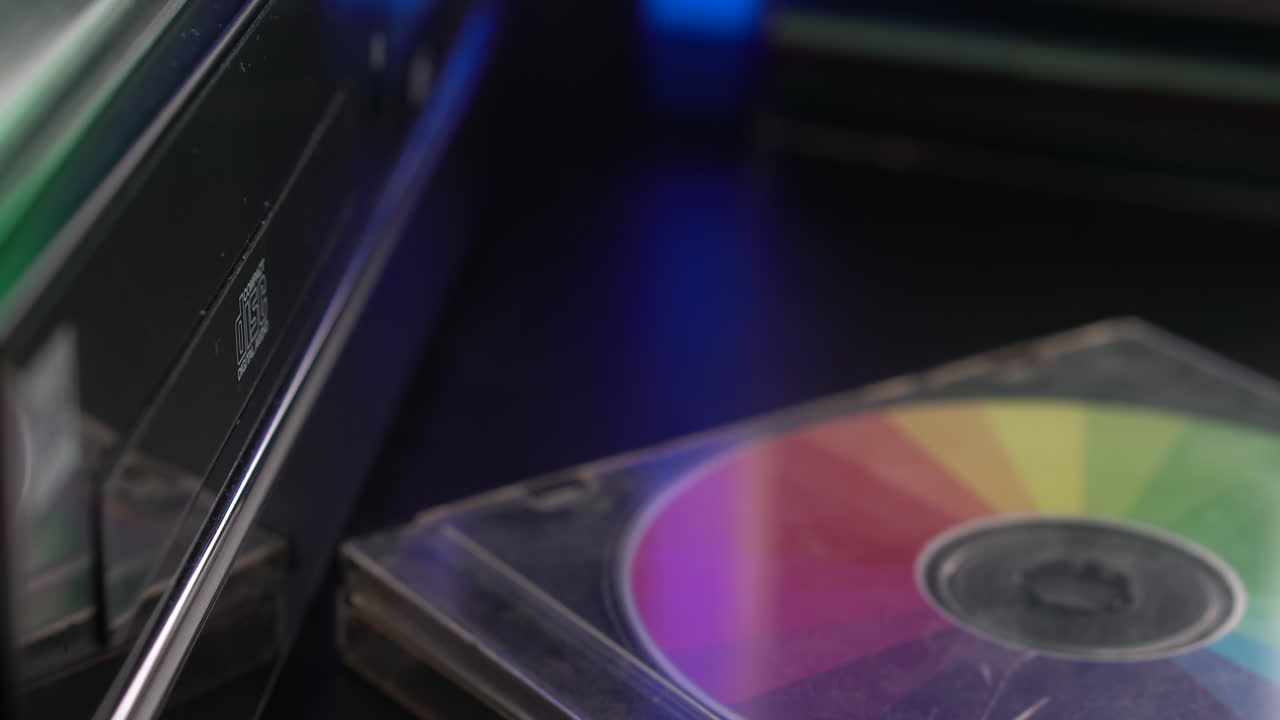 Replacing CD's in Tray of Compact Disc Player, Old Audio System, Close Up