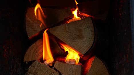 burning wood in the fire pit of a hot tub