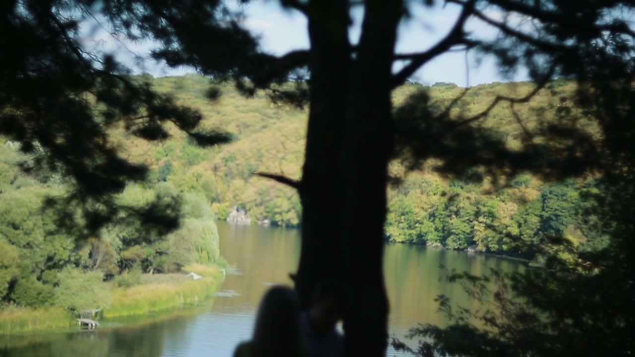Couple walking in forest. Pair of people walking in forest near river