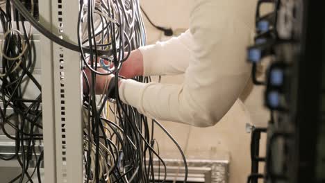 technician configures the network equipment in the server room