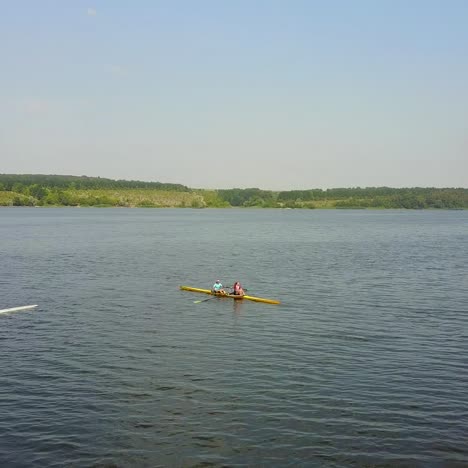 young children kayaking on river. people in boat rowing in kayak over the river