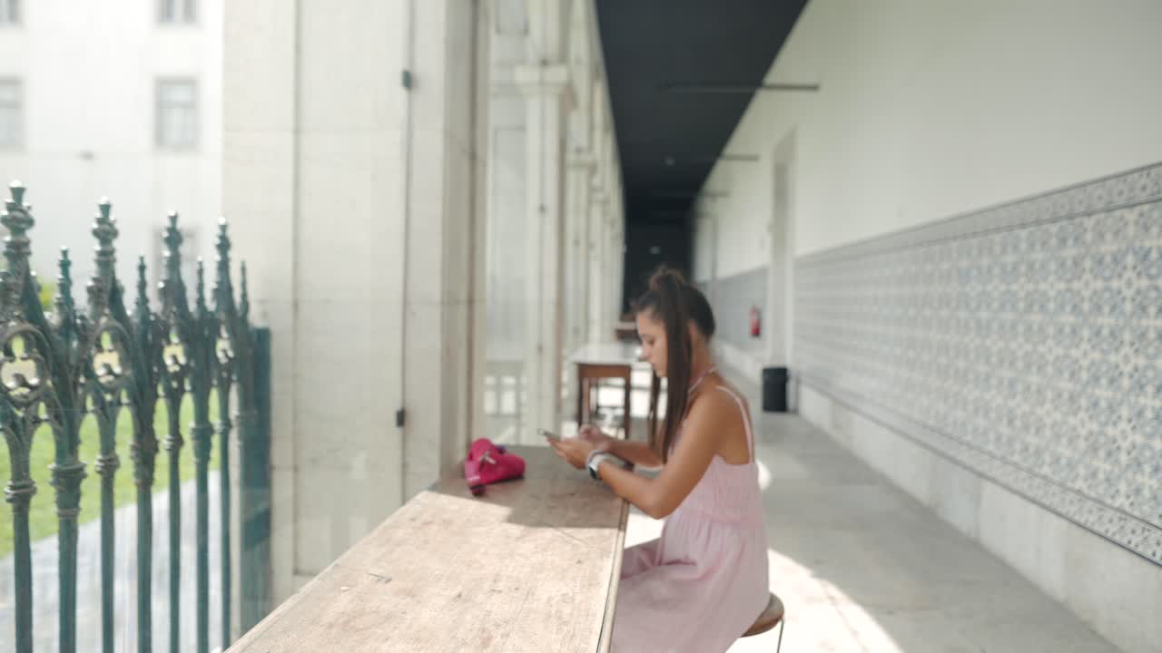 Woman sitting at a table in a building