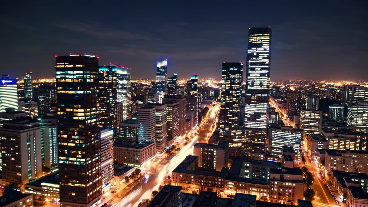 Stunning night skyline view of a vibrant city highlighting modern architecture and bustling streets illuminated by city lights