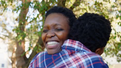 Twin-sisters-embracing-each-other-in-the-park-4k