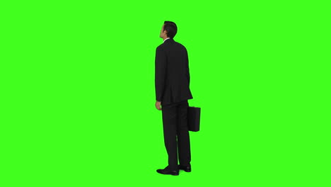 Businessman-standing-with-his-briefcase