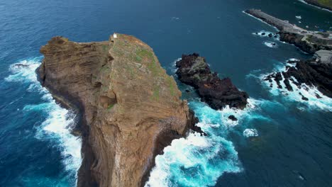 Rugged rocky lighthouse island in Porto Moniz, Ilheu Mole, Madeira