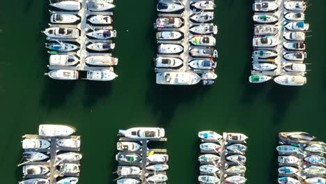 top down aerial view of yachts and boats moored in a marina in america