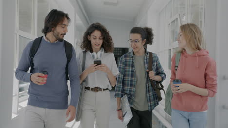students walking in a university hallway