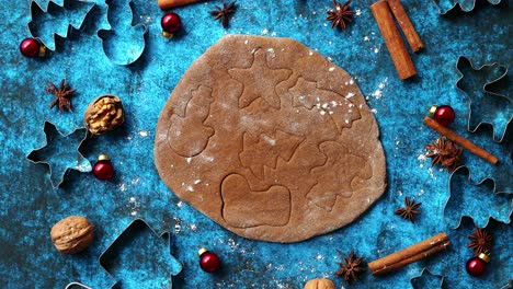 Christmas-baking-concept--Gingerbread-dough-with-different-cutter-shapes