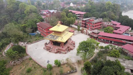 drone footage gracefully circling devdaha temple in chitwan, nepal, showcasing sacred architecture and lush surroundings from all angles. perfect for cultural, travel, and spiritual content