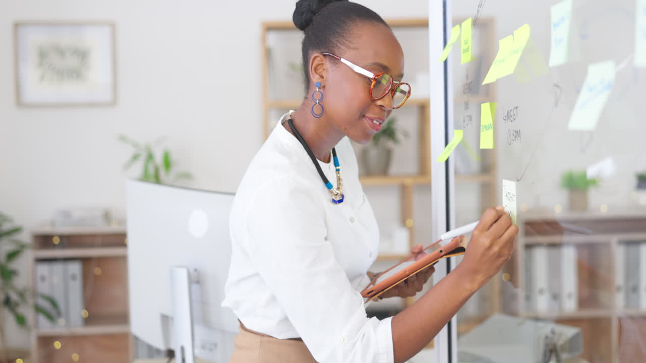 Happy black woman, tablet and writing