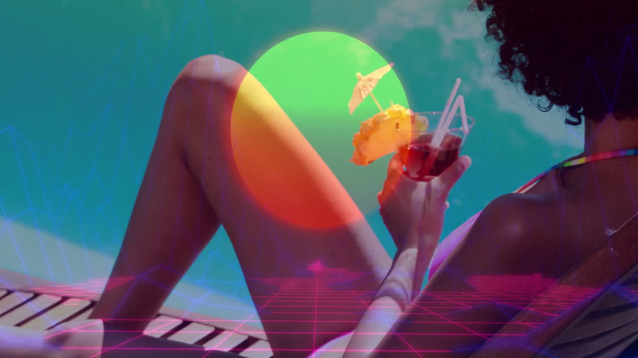 Tropical drink and sunset animation over person relaxing by pool
