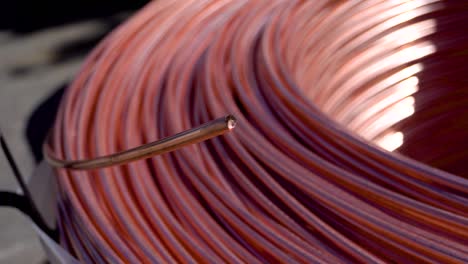 closeup of copper cable being rolled up in preparation for shipment at the factory