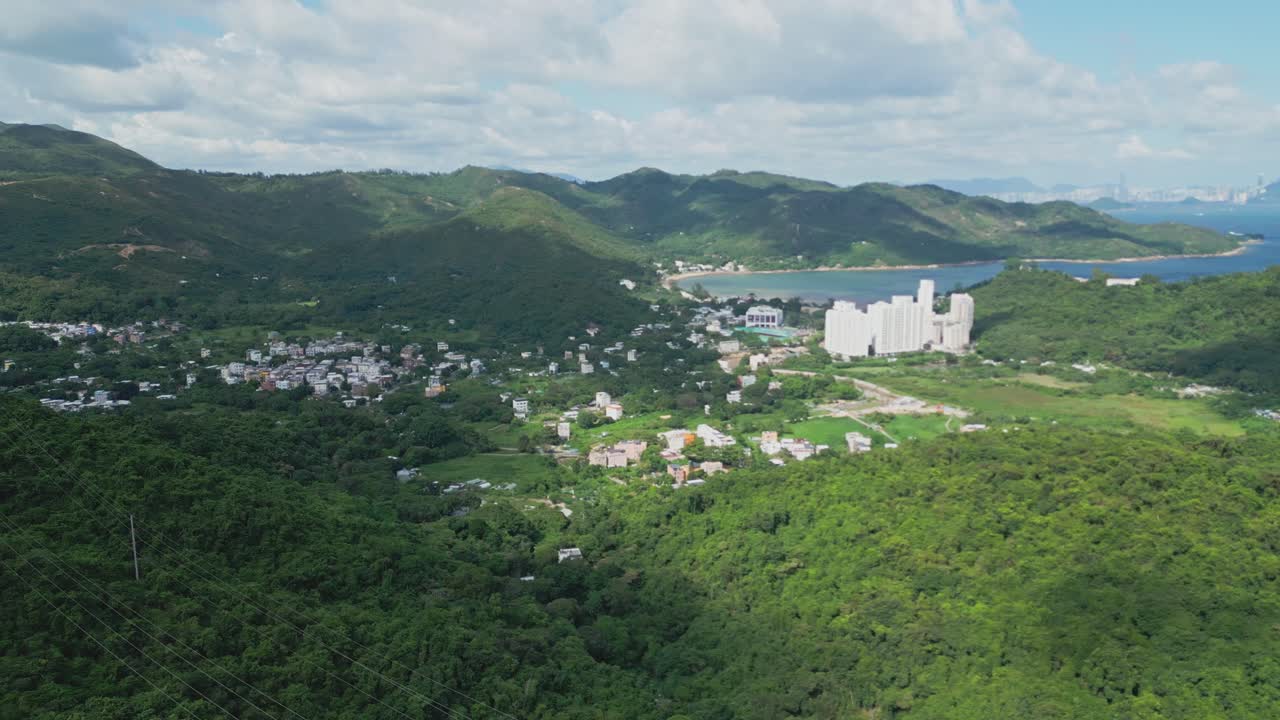 Footage of Mui Wo, a rural town on Lantau Island in Hong Kong, featuring coastal scenery, traditional buildings, lush greenery, and the serene lifestyle of this eastern coastal town