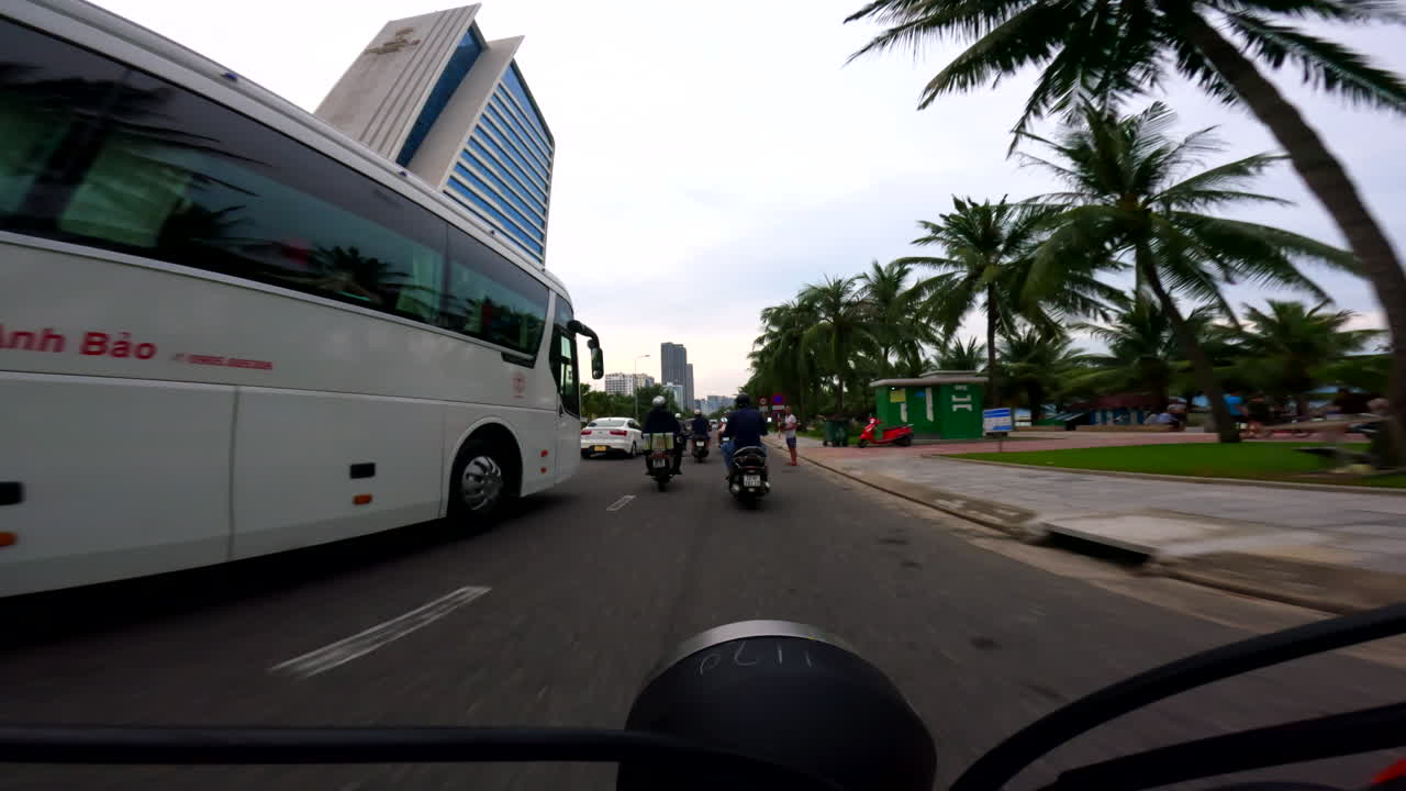 Da Nang, Vietnam - Cruising Through the City on a Scooter With the Grand Tourane Hotel Coming Into View - POV