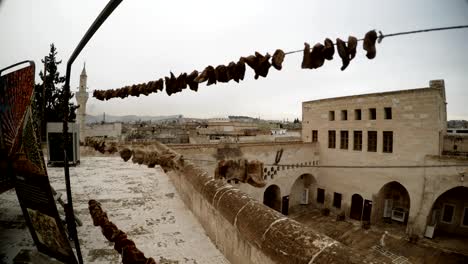 fruits dry on ropes on background old stone town urfa