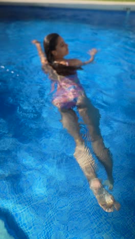 woman swimming in a pool