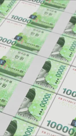 vertical video of 10000 south korean won banknotes printing by a money press