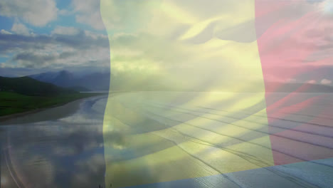 Digital-composition-of-waving-belgium-flag-against-aerial-view-of-the-beach