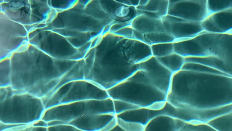 mesmerizing turquoise waves ripple surface of refreshing pool