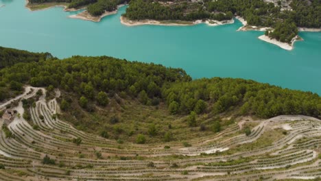 aerial shot panning up over nature and mountains in el castell de guadalest