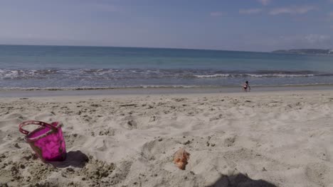 a girl plays and enjoys a sunny day at a mexican beach