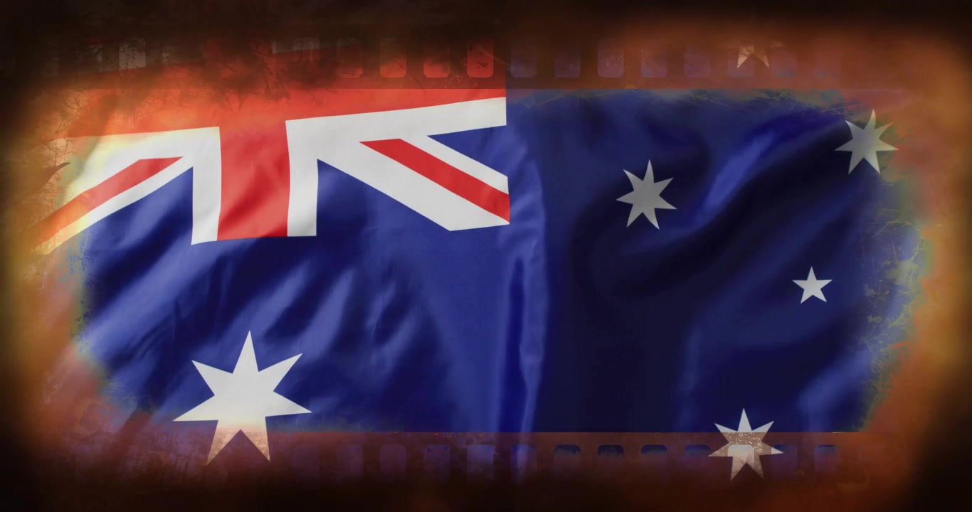 Australsk flag blafrer i brisen, med skiftende folder og en filmstrimmel-brændt vignetindramning.