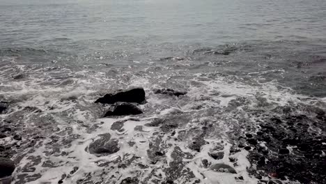 Ocean-Waves-On-Black-Pebble-Stone-Beach-Mystery-Horror-at-Bali-Indonesia-Southeast-Asia