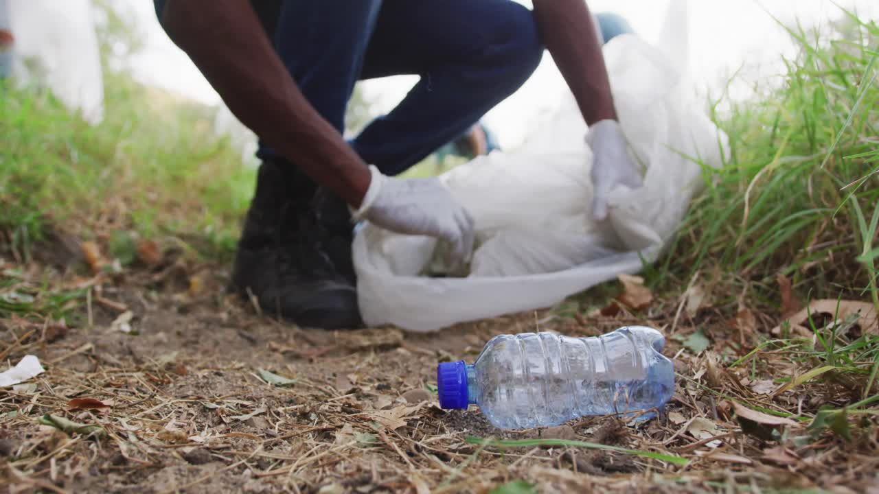 African American man volunteering during river clean-up day