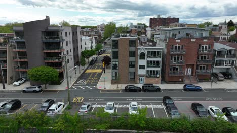 urban city housing with driveway and on street parking for cars and vehicles