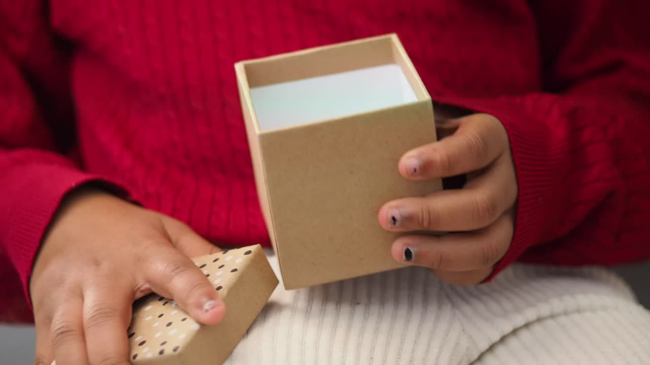 Child opening a gift
