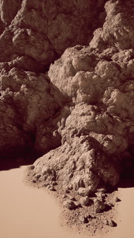 majestic rock formation amid sandy beach