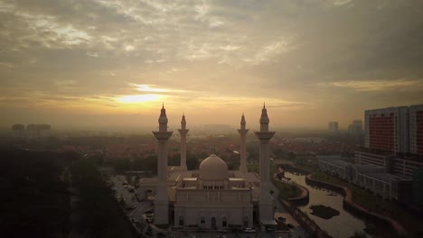 aerial footage - sunrise at a mosque.