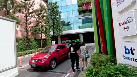 people walking near true digital park entrance