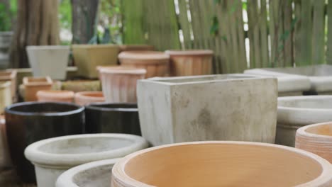 close up of multiple empty flowerpots in garden