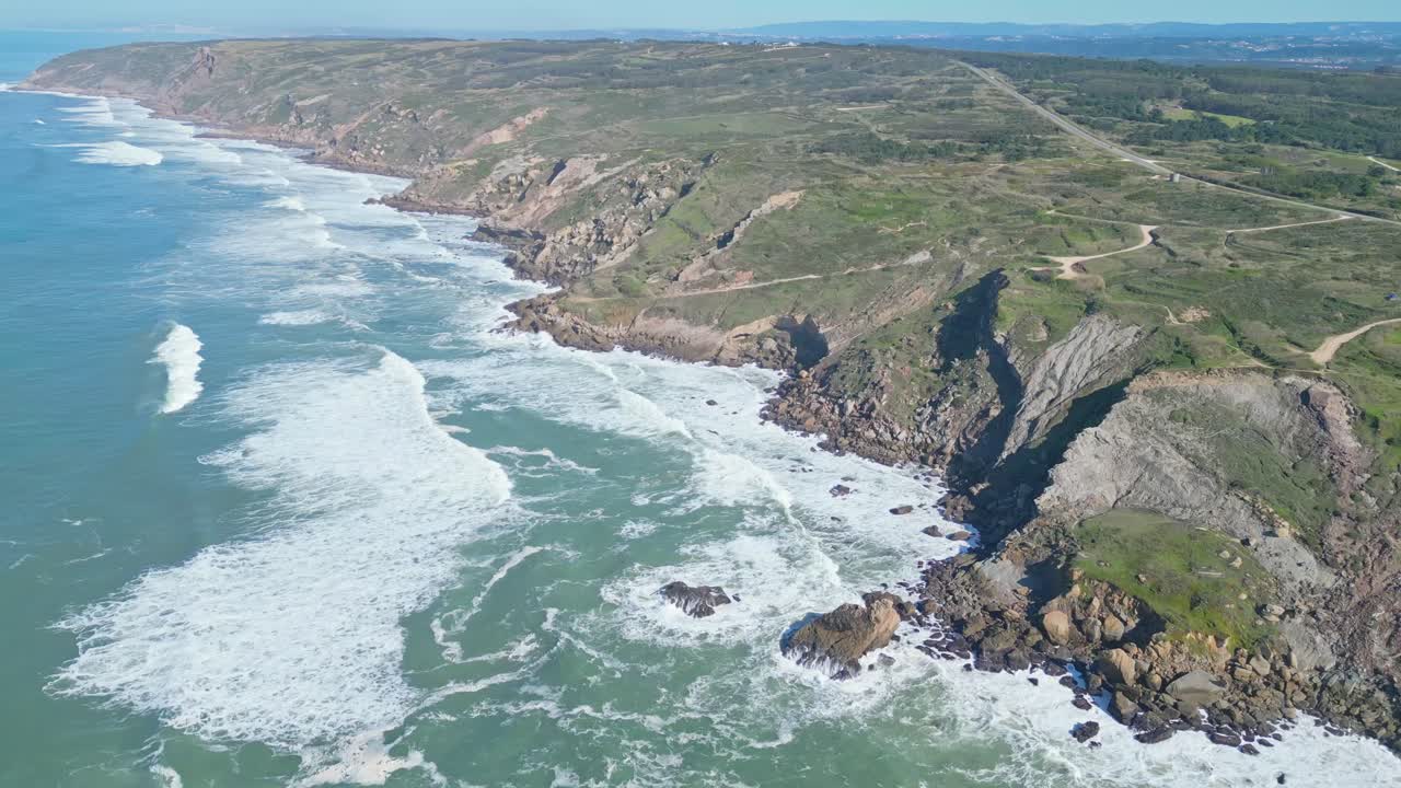 Cliffs and ocean waves at Miradouro do Salgado viewpoint, Nazaré, Portugal