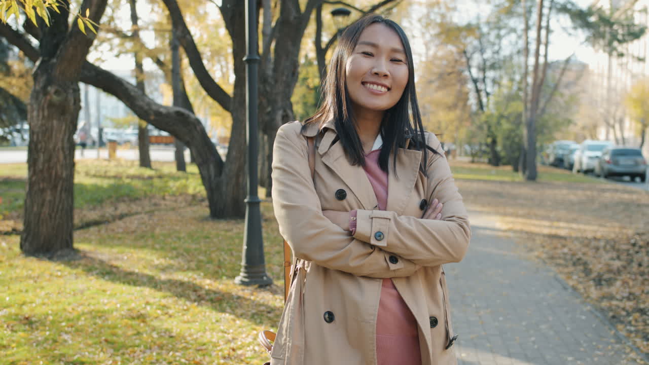 Smiling Asian Woman in Park