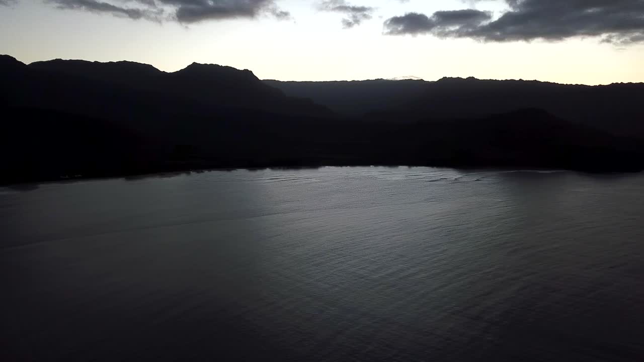 Drone bird's eye view one eighty degree pan of Hanalei Bay at sunset in Kauai, Hawaii