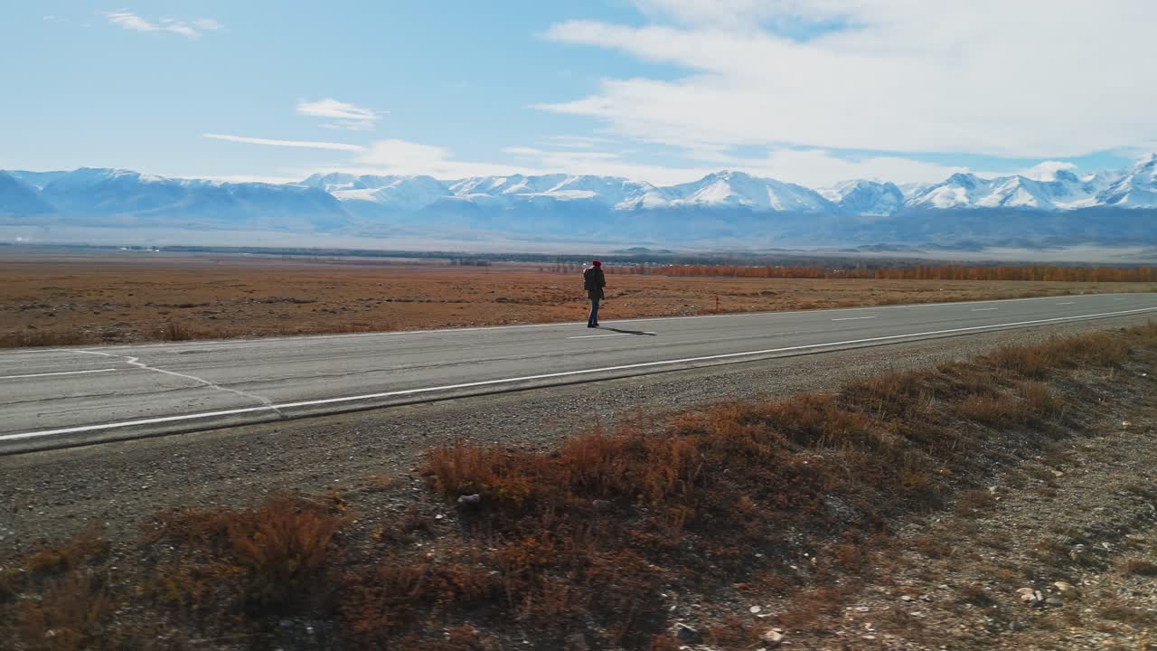 Traveler on a Mountain Road