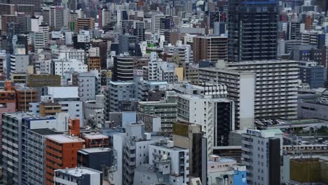 Close-o-view-over-the-densely-populated-skyline-of-Osaka,-Japan