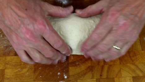 shaping home baked sourdough bread