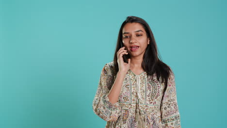 Woman-discussing-with-friend-over-telephone-call