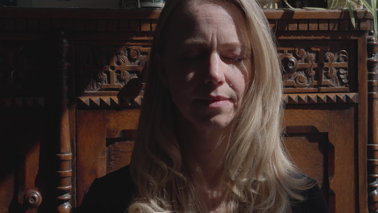 Woman doing yoga and meditation indoors
