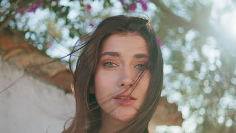 windy hair lady posing summer nature portrait. sexy model face looking camera