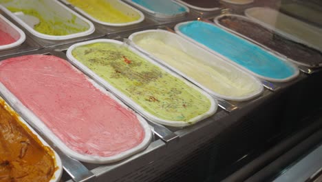 variety of flavors in an ice cream display case