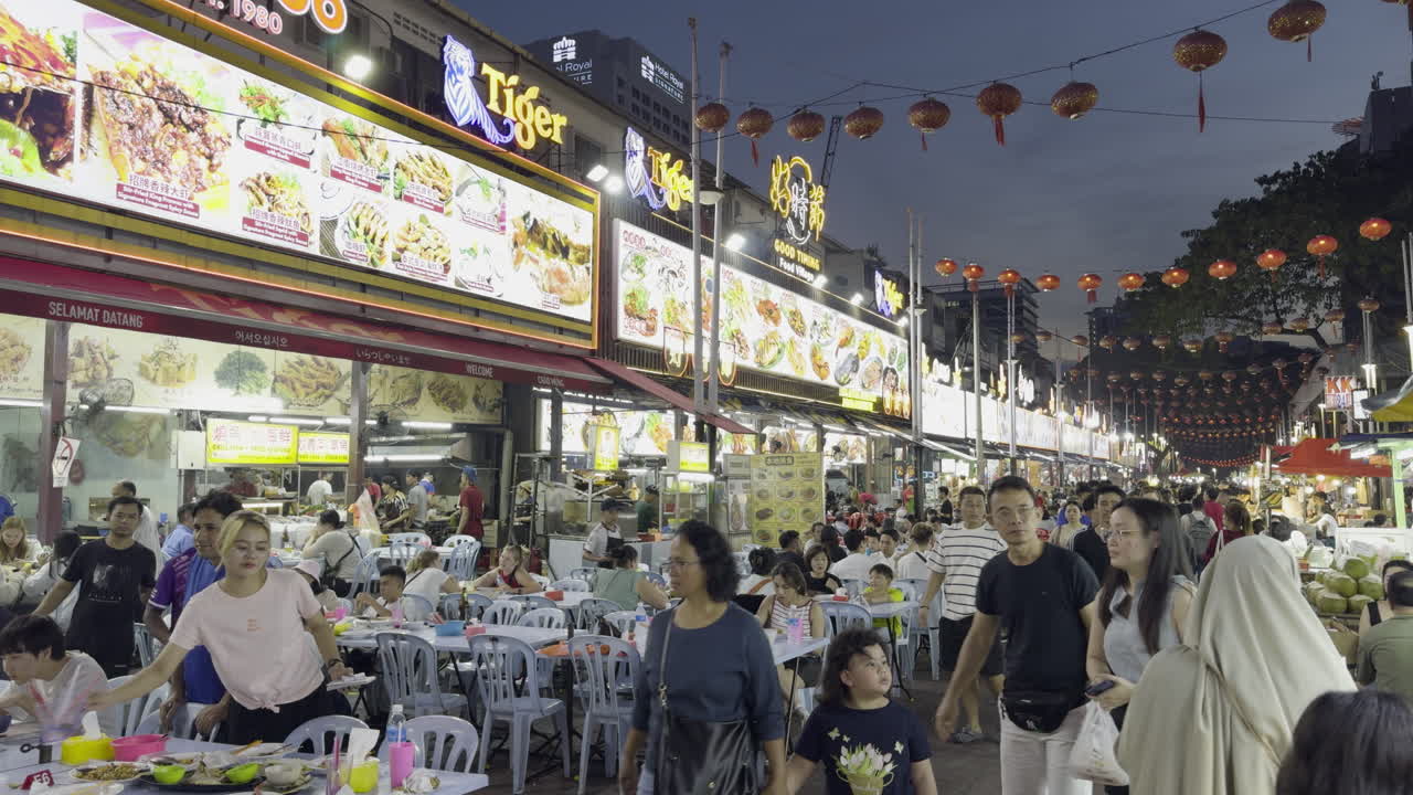 Tourists Walking on Busy Jalan Alor Food Street at Night. Kuala Lumpur, Malaysia