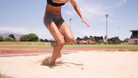 sportswoman doing long jump