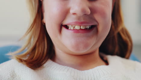 close-up of a smiling young girl's teeth