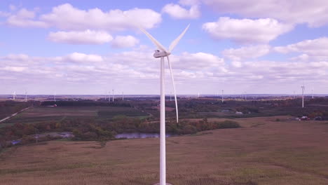 aerial view of wind turbine creating green and renewable energy